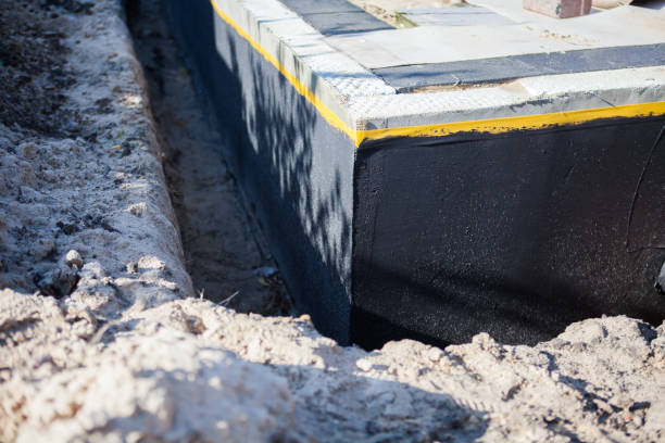 Professional Waterproofing technician working in Wolcott, IN